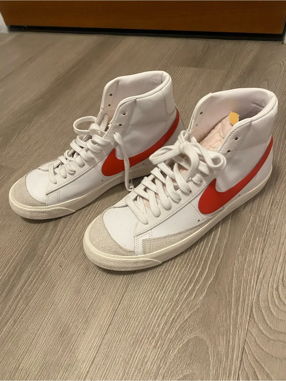 Nike White High-Top Sneakers with Red Swoosh Accent